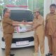 Pj Bupati Konawe Resmi Serahkan Mobil Ambulance Desa