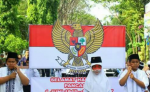Pawai lambang Garuda Pancasila dan Bendera Merah Putih. Seperti yang dilakukan oleh siswa-siswi SDN Sukabumi 2, Kecamatan Mayangan, Kota Probolinggo. FOTO : ASL