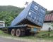 Hindari Kabel Listrik, Truk Kontainer Terperosok ke Selokan