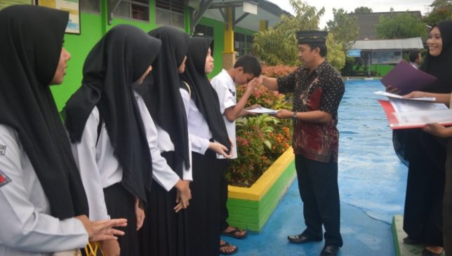 Lulus 100 Persen, Ini yang Dilakukan Siswa dan Guru SMPN 9 Kendari